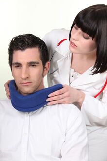 The doctor puts the Shants necklace on the patient. 