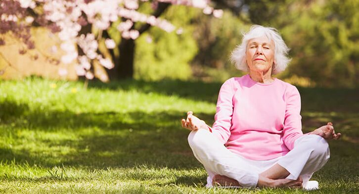 old woman meditating with hip osteoarthritis